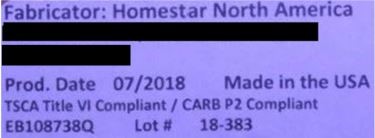 The model number is printed on a label on the back of the recalled dressers.