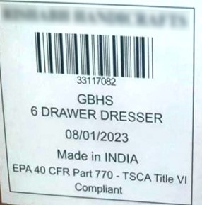 White label on the back of the recalled dresser